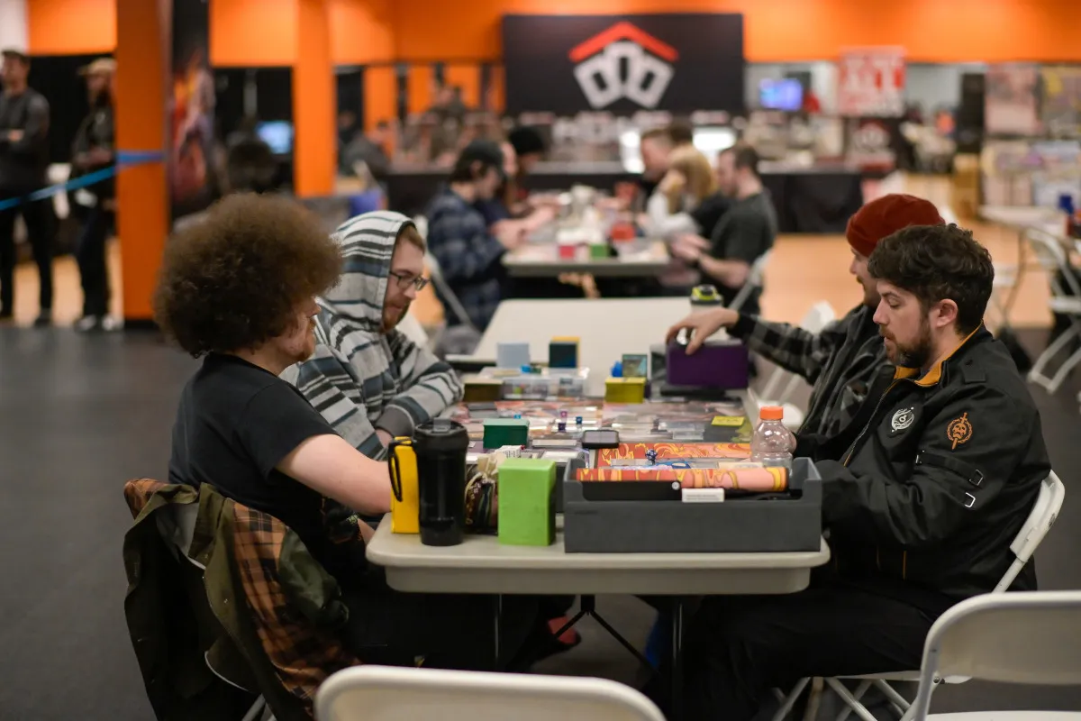 Group of community members playing commander at Chillarpillar open