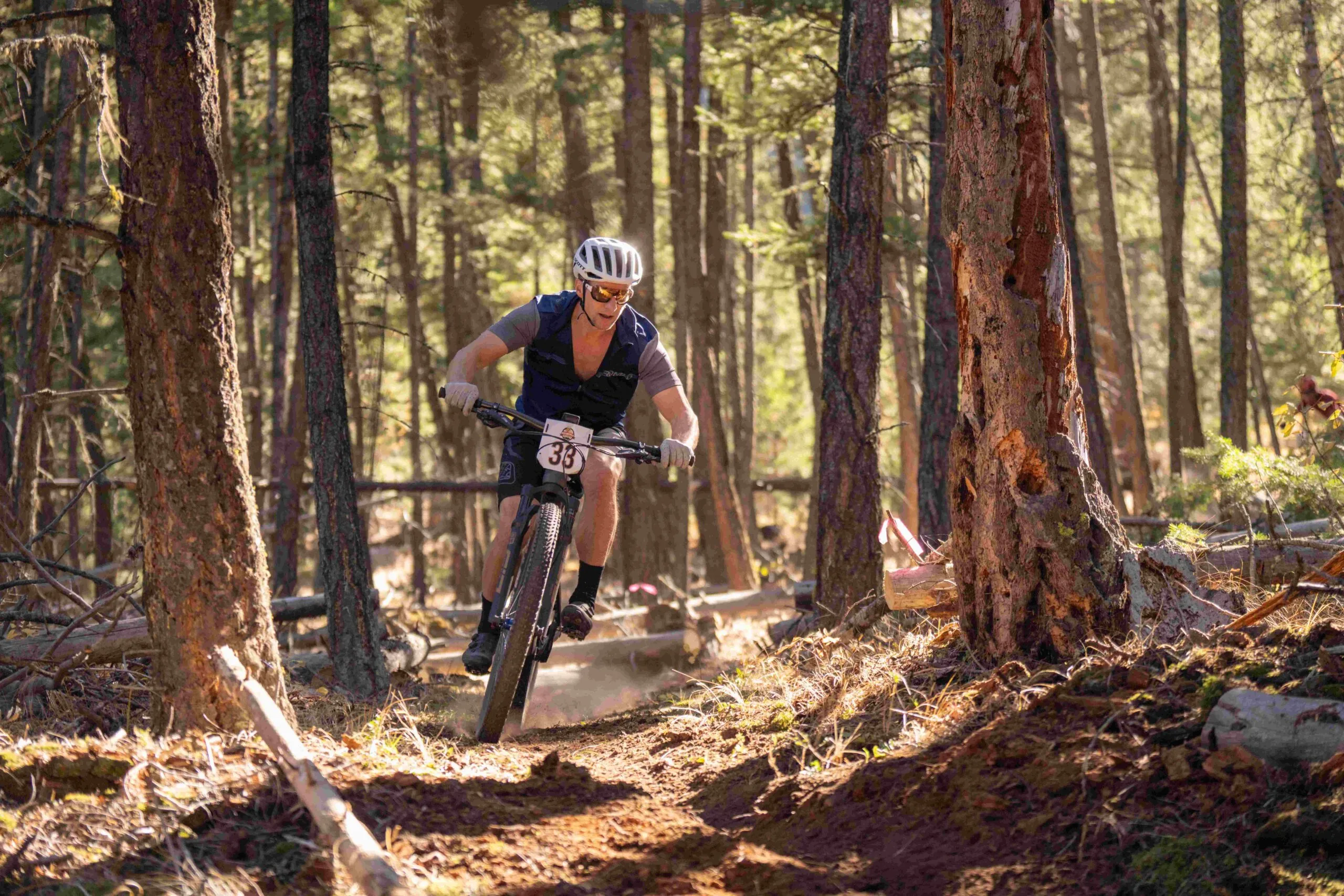 Man biking through woods